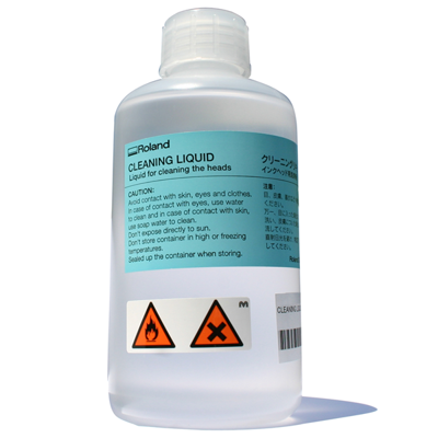 A 500ml bottle of Roland cleaning liquid with a label and safety warnings.