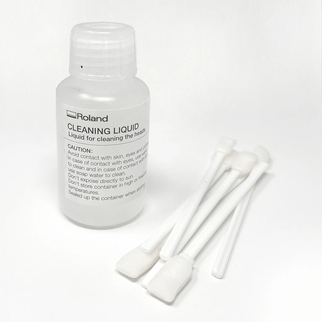 Roland cleaning liquid bottle with three cotton swabs on a white background